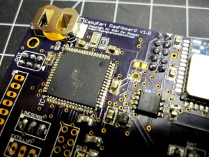 Prototype board with battery-backed RTC (lithium cell holder, upper left, quartz crystal to its right)